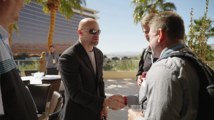 Chad E. Foster shakes hands with audience members