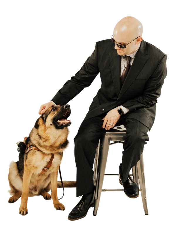 Chad E. Foster with his guide dog Sarge