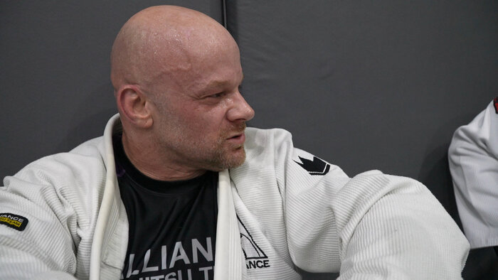 Chad E Foster talking with BJJ partners at Dubai martial arts facility