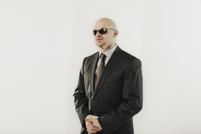 Chad E Foster in formal business suit, professional speaker photo