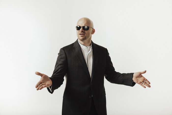 Professional business headshot of Chad E Foster in dark suit