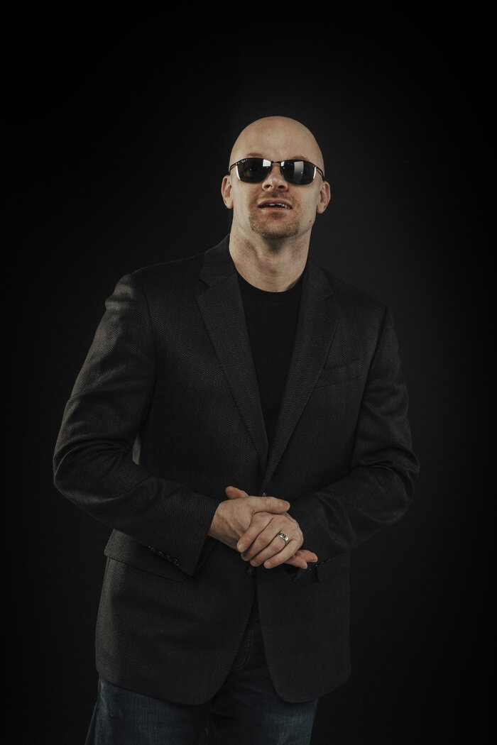 Professional vertical headshot of Chad E Foster in business attire