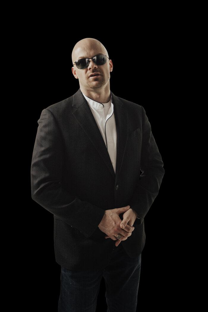 Vertical professional headshot of Chad E Foster in business suit