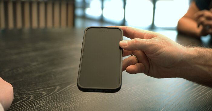 Chad E Foster on business phone call, demonstrating professional communication