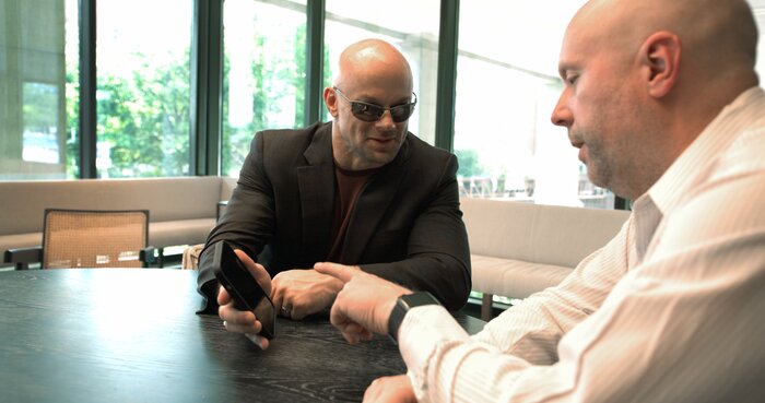Professional phone call with Chad E Foster managing business communications