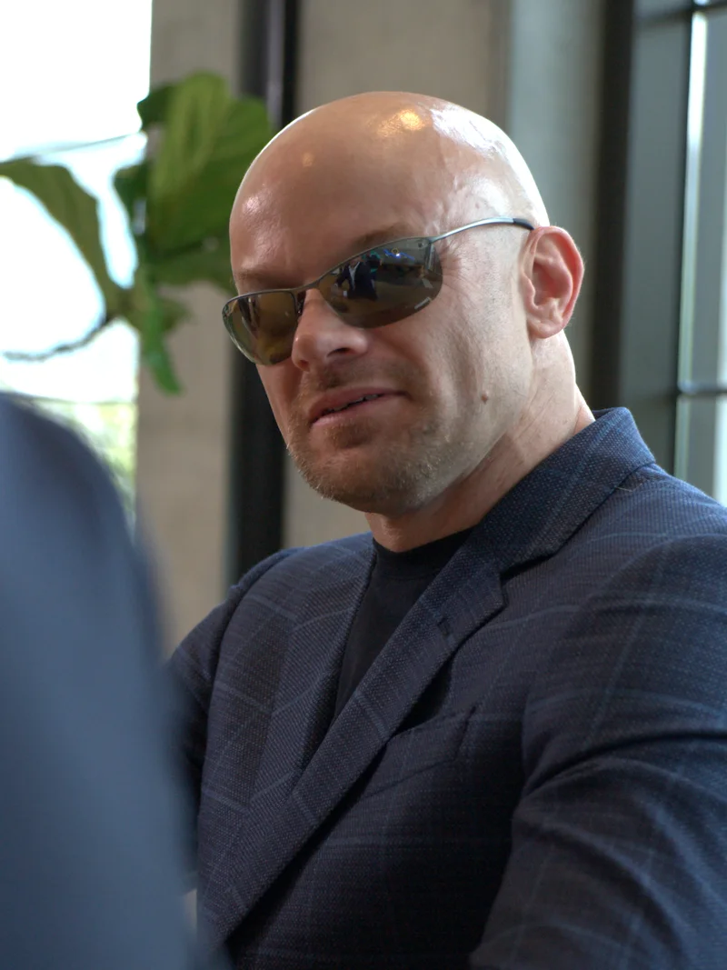 Chad E. Foster in a meeting